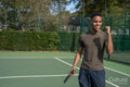 Smiling man in pickleball court