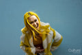 Young woman with yellow hair laughing outdoors