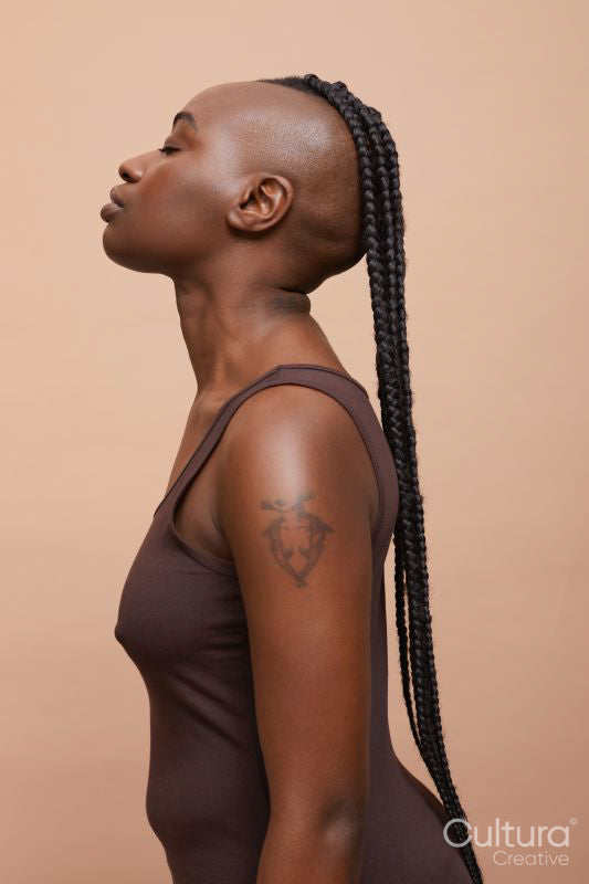 Profile portrait of beautiful woman with mohawk hair