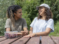 Friends laughing during picnic