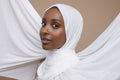 Studio portrait of young woman in white hijab