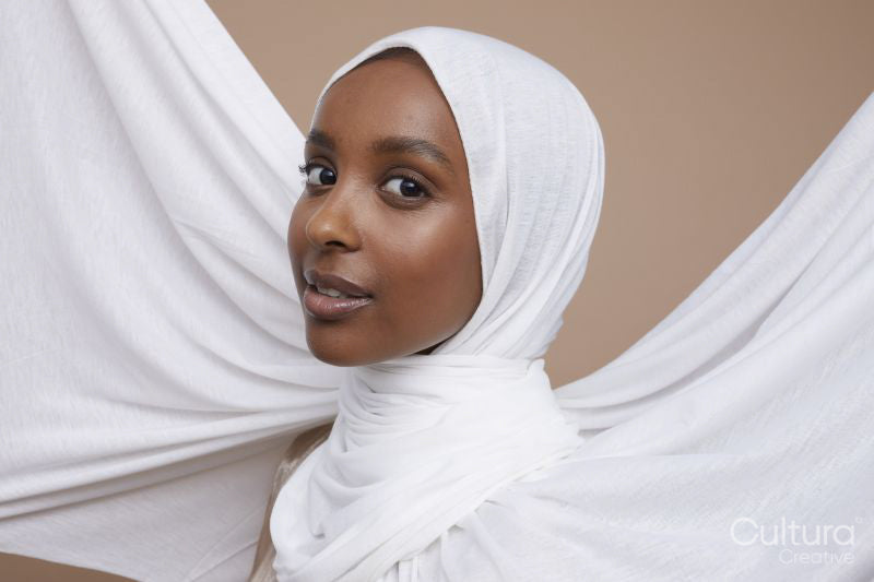 Studio portrait of young woman in white hijab