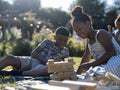 Siblings playing block removal game