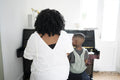 Mother and son playing piano