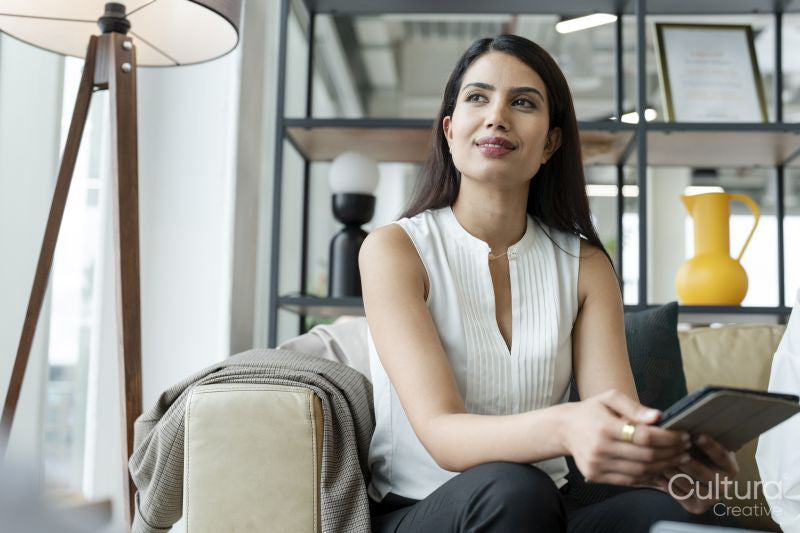 Woman resting in office lobby