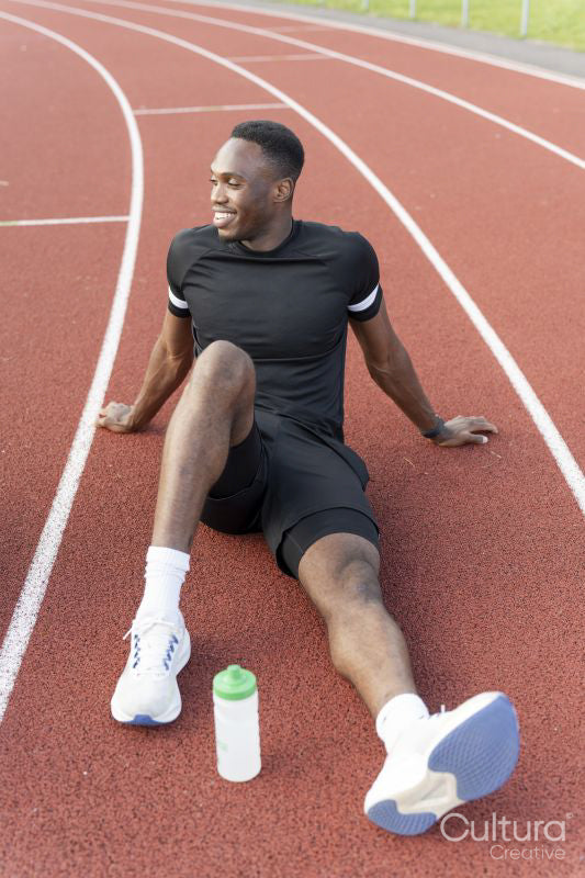 Athlete resting at sports track after training