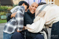 Family visiting senior man at nursing home
