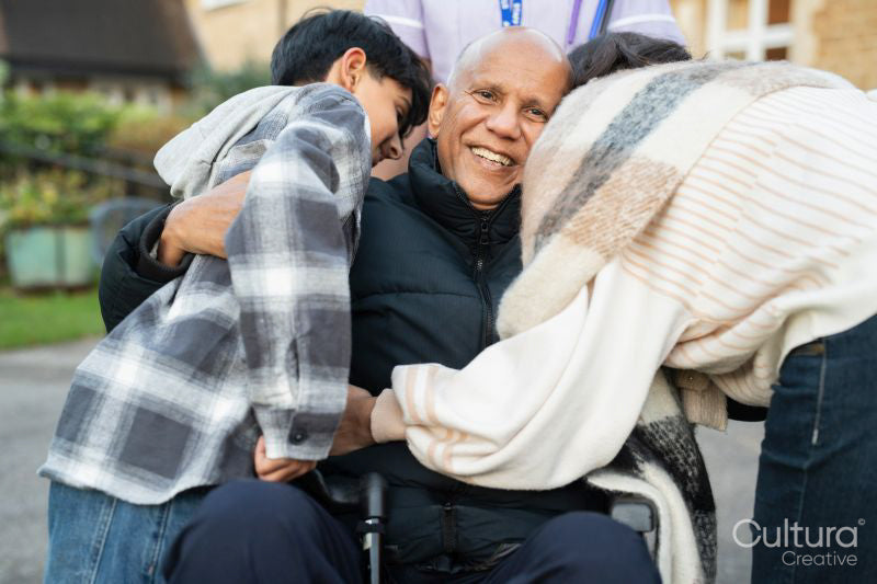 Family visiting senior man at nursing home