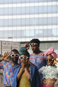 Fashion portrait of four people in urban street
