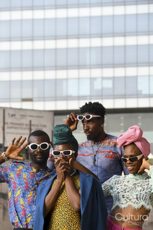 Fashion portrait of four people in urban street