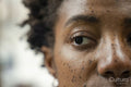 Close-up of woman face while looking away