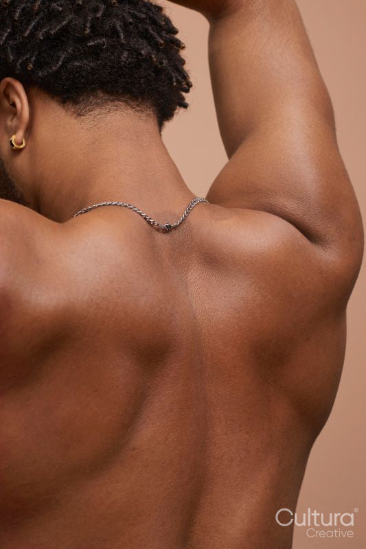 Studio rear shot of shirtless man