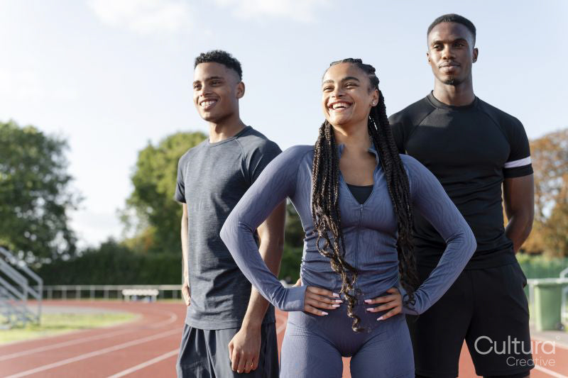 Portrait of group of athletes standing at stadium