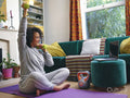 Woman lifting dumbbells at home