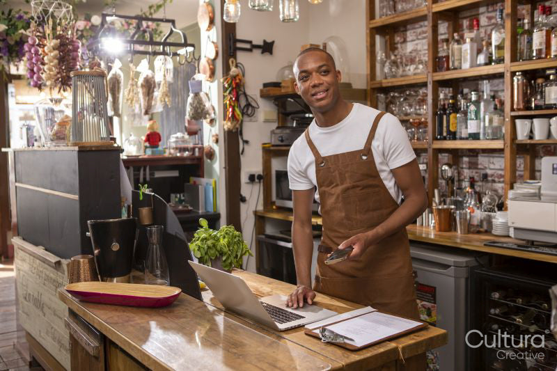 Portrait of smiling cafe owner