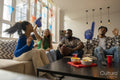 Friends watching sport game on TV at home