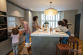 Family preparing dinner in kitchen
