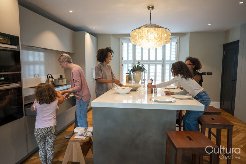 Family preparing dinner in kitchen