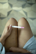 Close-up of woman holding pregnancy test