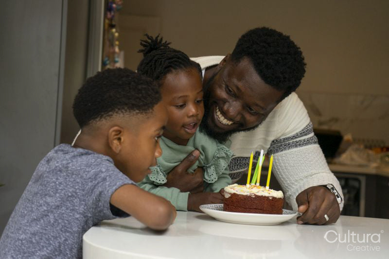 Father and children celebrating birthday
