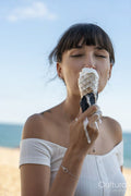 Woman eating melting ice-cream