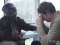 Therapist giving patient handkerchief in therapy session