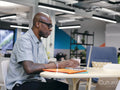 Man using laptop in office space