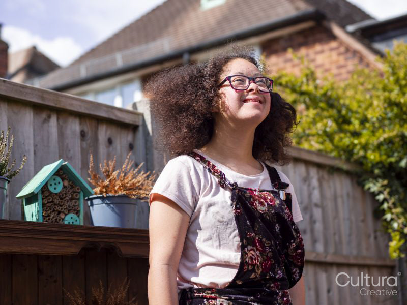 Girl standing in backyard