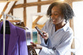 Fashion designer photographing color swatches with clothing