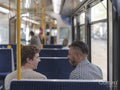 South Yorkshire, Smiling couple talking in tram