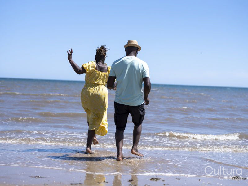 Mature couple wading in sea