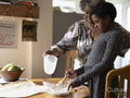 Mother and daughter baking at home