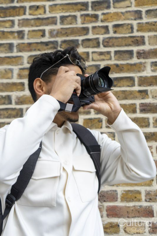 Young man using camera