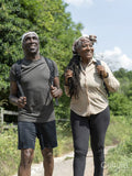 Smiling mature couple hiking in summer