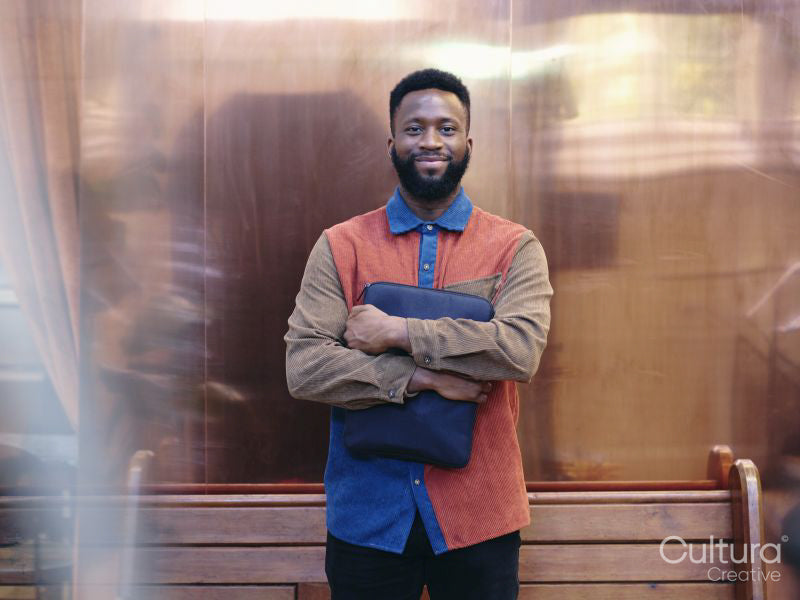 Portrait of smiling businessman in creative studio