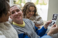 Smiling couple with daughter looking at baby ultrasound image