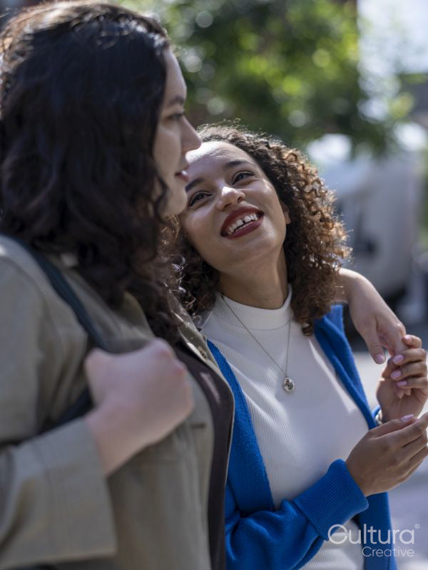 Smiling couple embracing outdoors