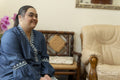 Portrait of young woman with down syndrome at home