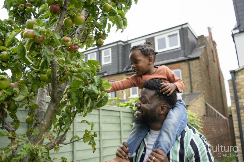 Father giving daughter piggyback ride