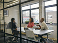 Colleagues talking at business meeting