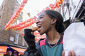 Young woman eating taiyaki in Chinatown