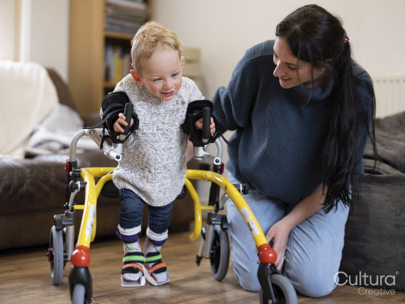 Mother assisting son with walking