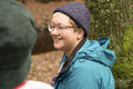 Smiling woman relaxing in forest