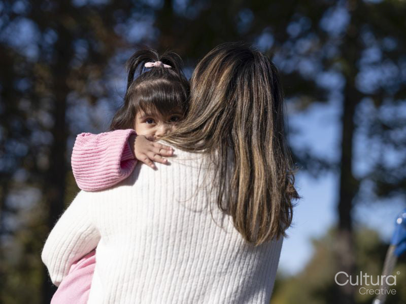 Mother hugging daughter with Down syndrome