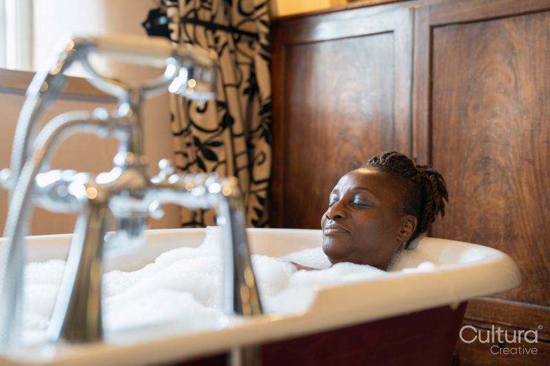Senior woman taking bubble bath