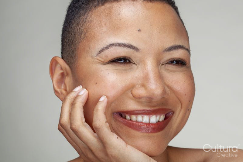 Studio portrait of smiling woman