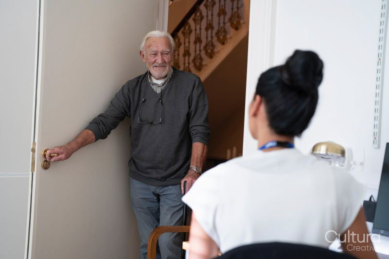 Smiling senior patient entering doctors office