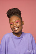 Studio portrait of smiling woman