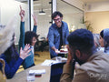 Coworkers celebrating birthday in office