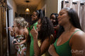 Group of women applying makeup before going to party